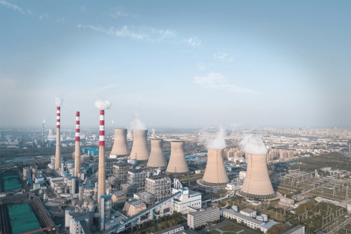 Plant Exterior with smoke billowing from Chimneys