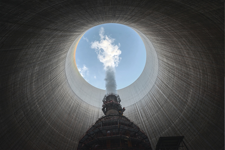 Man looking up a flue-stack