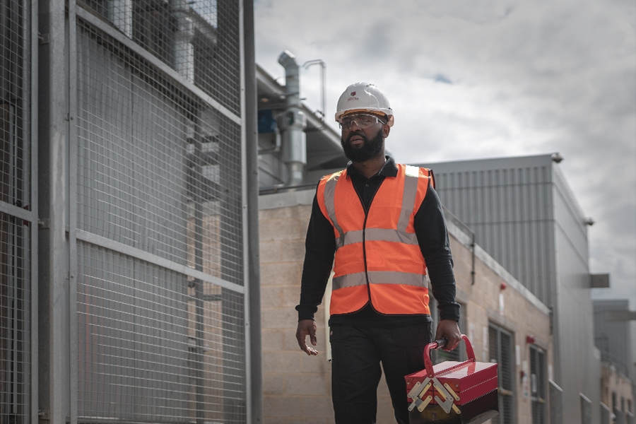 Member of Service team walking to analyzer