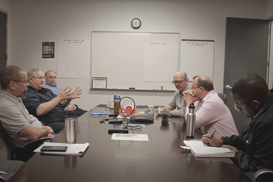 People sat at conference table