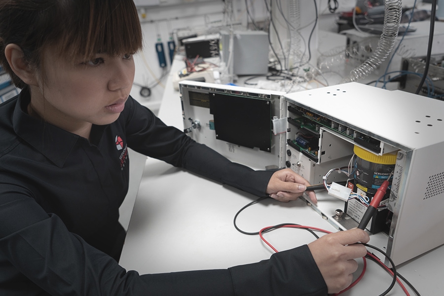 Woman testing gas sensor