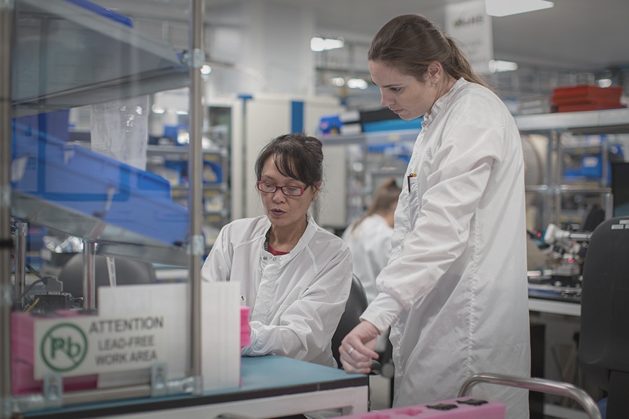 Women in a lab wearing labcoats