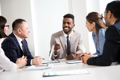 Multy-ethnic group of business people working at the office desk