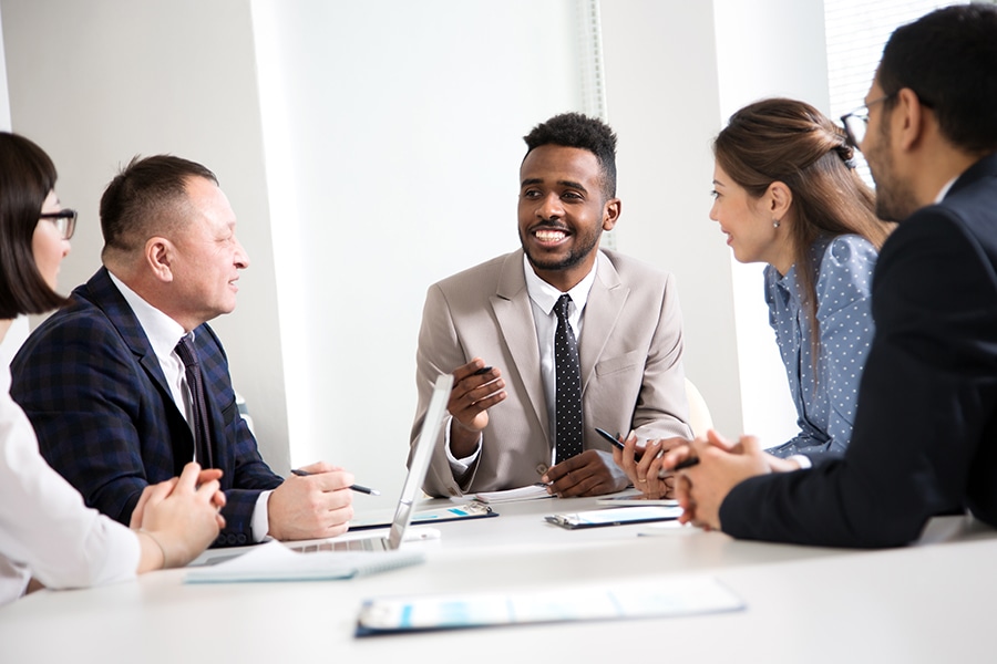 Multy-ethnic group of business people working at the office desk