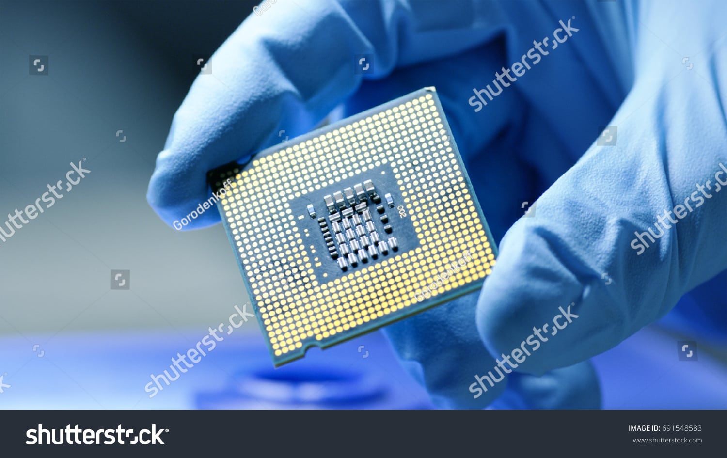 close up presentation of a new generation microchip gloved hand holding piece of technological
